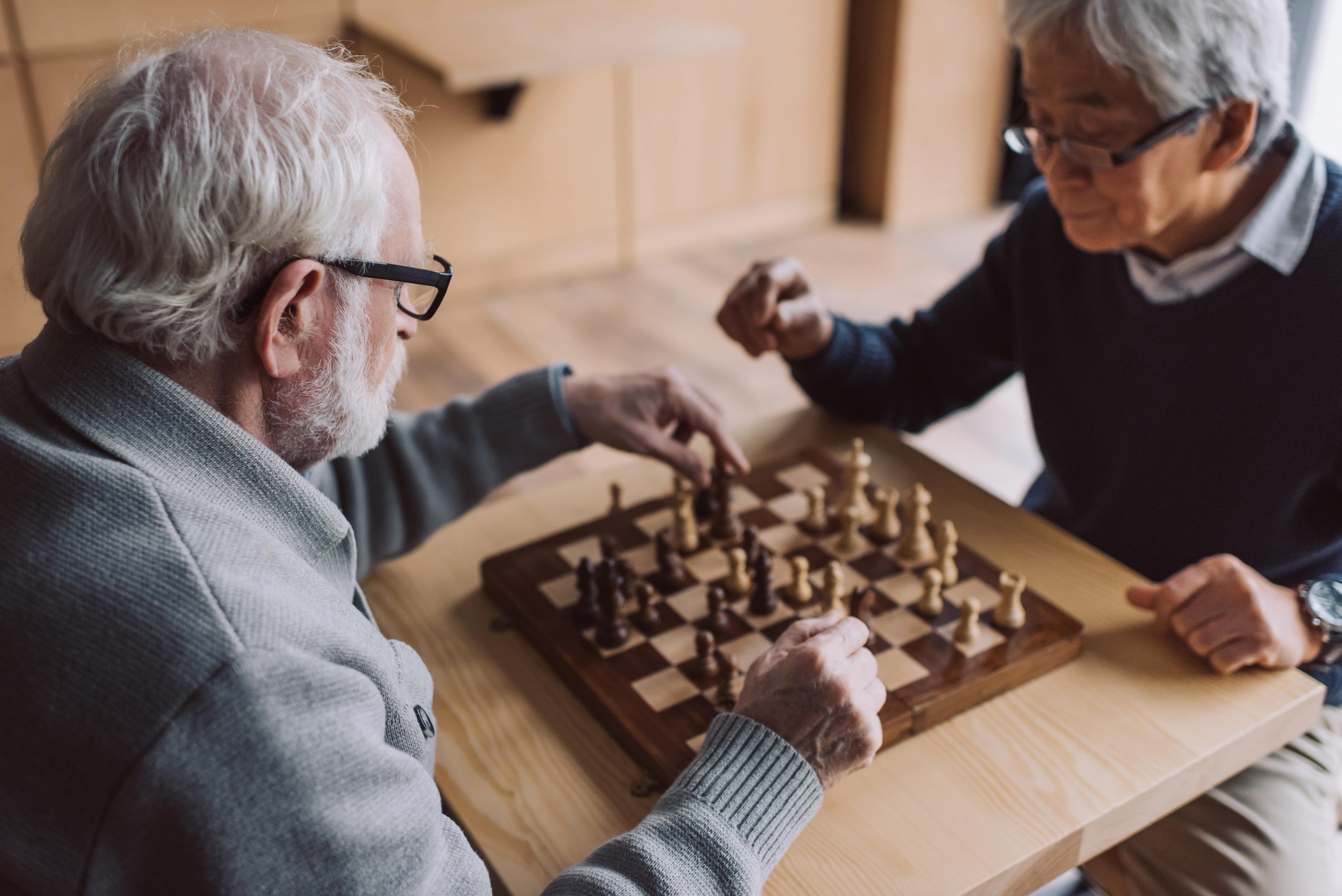 multiethnic-senior-men-playing-chess-in-leisure-cl-2024-11-17-11-24-12-utc-min